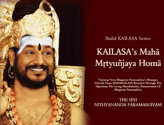A promotional graphic for the KAILASA Build KAILASA series titled KAILASA's Mahā Mṛtyuñjaya Homā. On the left, a smiling man with a gold crown, white forehead markings, a dark bindi, gold earrings, and orange and beaded malas around his neck raises one hand in a blessing gesture against a warm gold and maroon background. A golden ornate throne is partly visible behind him. The right side carries the title and subtitle text on a deep red panel.