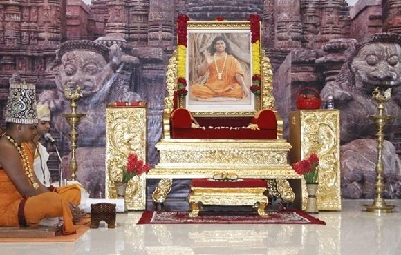 Paduka Puja being offered to the sacred padukas of Paramahamsa Nithyananda by devotees all around the world