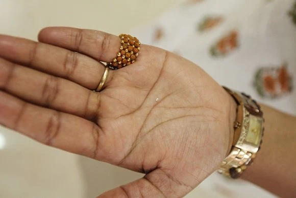 A small diamond got materialized from devotee's mouth in the direct Presence of Swamiji in Bidadi ashram