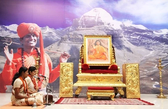 Paduka Puja being offered to the sacred padukas of Paramahamsa Nithyananda by devotees around the World