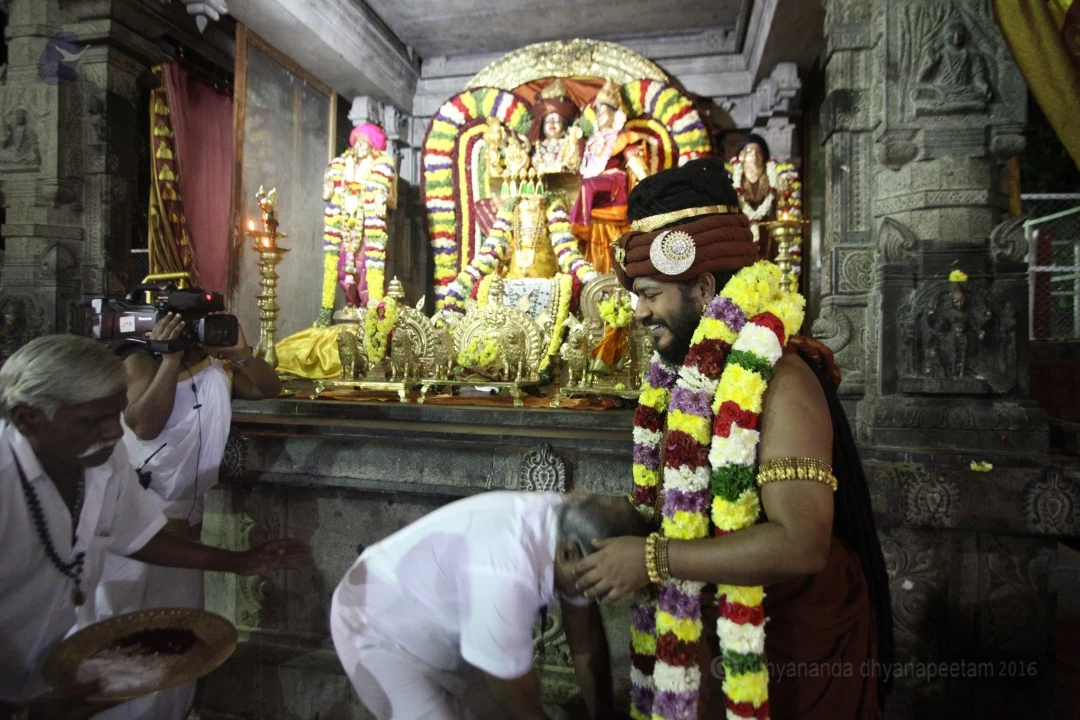 They give the offering to Him, touch His Lotus Feet and take blessings.