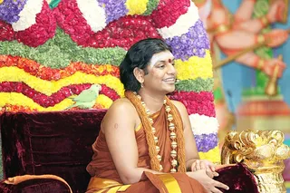 Swamiji greets devotees everywhere - on TV, on the web and in the satsang hall.