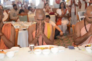 Brahmacharis of the Nithyananda Order chanting sacred scriptures for the departed souls