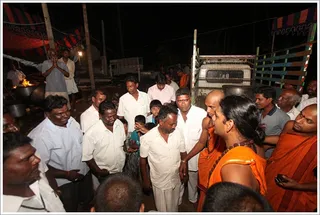 Swamiji blesses the cooks working 24/7 to provide hot meals throughout the day.