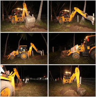 JCB continues to work in the night also to clear the debris...