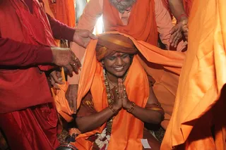 Swamiji is adorned with the traditional Kavi shawl as part of the Pattabishekam, the coronation ceremony as Maha Mandaleshwar