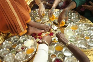 Pratyaksha Pada Puja being performed to the Divine Lotus Feet of Swamiji