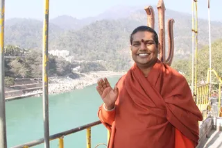 With the Holy river Ganga behind Bhagavan Sri Nithyananda Paramashivam Gracefully blesses from atop the Kailaasa Niketan Temple in Rishikesh