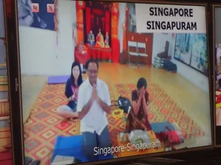 Singapore Sanga receiving blessings from Swamiji over 2way video conferencing