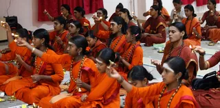 Offering arati to Swamiji