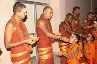Following the tradition the Sannyasis of Nithyananda order feed the youngest first