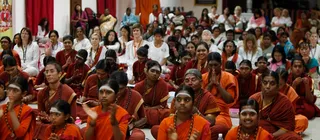 Devotees listening to Swamiji's discourse