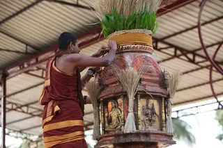 Nithyanandeshwara Temple priest hoists the Nithotsava flag