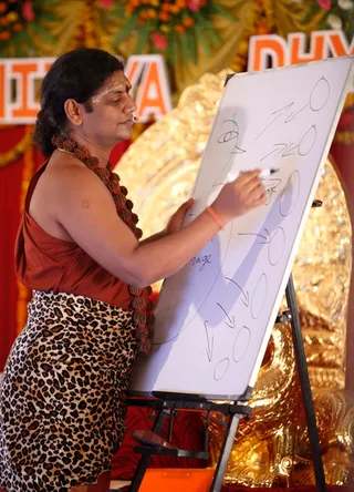 https://nithyananda.org/sites/default/files/photo-gallery/2014-05may-24-nithyananda-diary_IMG_1971_varanasi-ndy-nithya-satsang-nithya-dhyaan-yoga-session_0.JPG