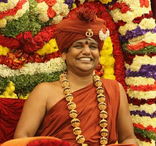 https://nithyananda.org/sites/default/files/photo-gallery/2014-09sep-26th-nithyananda-diary_IMG_9419_bidadi-navaratri-celebration-swamiji.JPG?1411813360