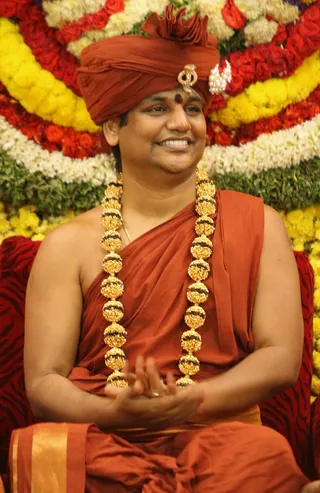 https://nithyananda.org/sites/default/files/photo-gallery/2014-09sep-26th-nithyananda-diary_IMG_9499_bidadi-navaratri-celebration-swamiji.JPG?1411813386