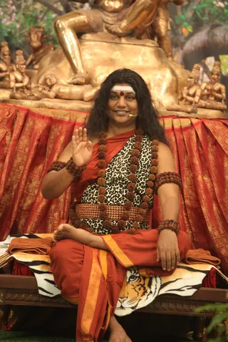 http://nithyananda.org/sites/default/files/photo-gallery/2015-01jan-26th-nithyananda-diary_IMG_1628_bidadi-nky-day4-shivoham-session-swamiji.JPG