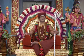 Swamiji in a Meditative Posture with the Trishul
