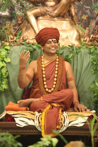 http://nithyananda.org/sites/default/files/photo-gallery/2015-03mar-20th-nithyananda-diary_IMG_5097_bidadi-satsang-swamiji.JPG