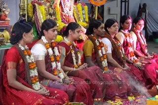 In this puja, married women having children hold the sacred space of Devi as the Divine Mother.