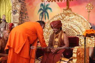 http://nithyananda.org/sites/default/files/photo-gallery/2015-10oct-22nd-nithyananda-diary_IMG_9004.JPG_varanasi-ia-satsang-vijayadashami-mahanirvani-puja-swamiji.JPG