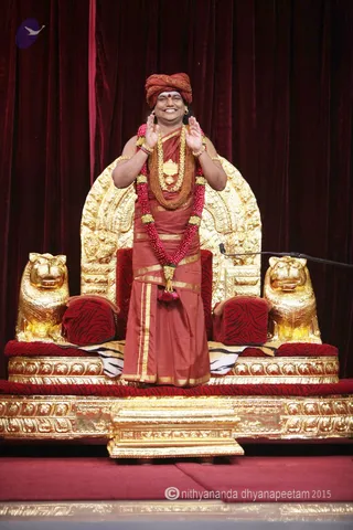 http://nithyananda.org/sites/default/files/photo-gallery/2015-11nov-10th-nithyananda-diary_IMG_2835_bidadi-raja-sabha-satsang-swamiji-blessing.JPG