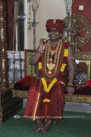 http://nithyananda.org/sites/default/files/photo-gallery/2015-11nov-25th-nithyananda-diary_IMG_1463_blr-adheenam-nithyanandeshwara-brahmotsavam-morning-bharani-deepam-swing-swamiji.JPG