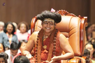 Through the 21-day program, Swamiji received dozens of brilliantly colored tropical flower garlands from participants eagerly awaiting to adorn him.
