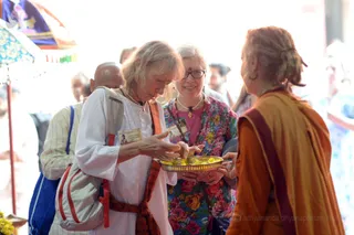 Participants apply Kumkum. The red processed turmeric helps detoxify the Third Eye.