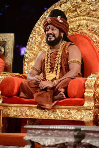 In His usual blissful mood, The Avatar watches the demonstrations, thrilled that the great spiritual powers of Sadashiva are once again being expressed through His disciples.