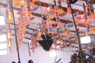Participants are demonstrating Rope Yoga which takes fearlessness and flexibility.