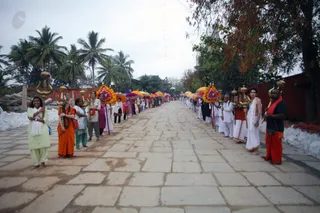 The participants await the arrival of His Holiness to begin the Brahmotsavam by raising the flag.