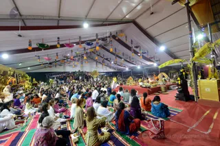 Delegates are patiently but enthusiastically waiting for His Holiness to arrive
