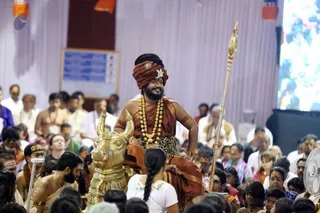 Blissfully resting on His vehicle, Nandi, Sadashiva brings the delegates closer to His Space.