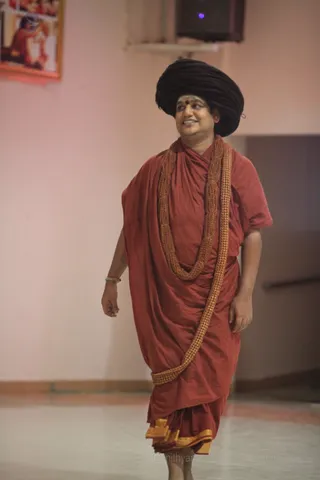 His Holiness gracefully enters the meditation hall