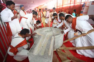 Teamily work! The base for a beautiful Shiva Ligam is getting placed in the temple.
