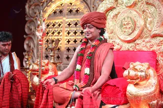 Kavi scarves are passed out to all the Shuddhadvaita participants