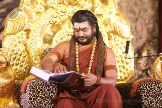 His Holiness scanning Sacred Scriptures