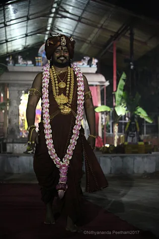 https://nithyananda.org/sites/default/files/photo-gallery/2017-11-Nov-23-nithyananda-diary_bengaluru-adheenam_nithyanandeshwara-brahmotsavam-dhwajarohanam_IMG_7345.jpg?1511454237