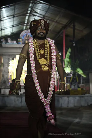 https://nithyananda.org/sites/default/files/photo-gallery/2017-11-Nov-23-nithyananda-diary_bengaluru-adheenam_nithyanandeshwara-brahmotsavam-dhwajarohanam_IMG_7346.jpg?1511454248