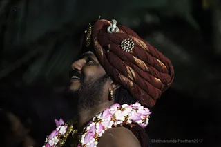 https://nithyananda.org/sites/default/files/photo-gallery/2017-11-Nov-23-nithyananda-diary_bengaluru-adheenam_nithyanandeshwara-brahmotsavam-dhwajarohanam_IMG_7439.jpg?1511454278