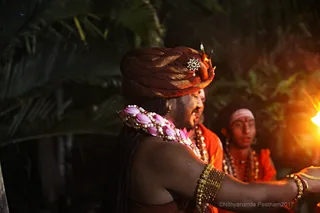 https://nithyananda.org/sites/default/files/photo-gallery/2017-11-Nov-23-nithyananda-diary_bengaluru-adheenam_nithyanandeshwara-brahmotsavam-dhwajarohanam_IMG_7489.jpg?1511454358