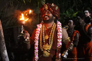 https://nithyananda.org/sites/default/files/photo-gallery/2017-11-Nov-23-nithyananda-diary_bengaluru-adheenam_nithyanandeshwara-brahmotsavam-dhwajarohanam_IMG_7505.jpg?1511454370