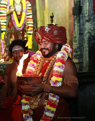 https://nithyananda.org/sites/default/files/photo-gallery/2017-12-Dec-02-nithyananda-diary_bengaluru-aadheenam_barani-deepam-nithyanandeshwara-temple_0T7A9438.jpg?1512289260