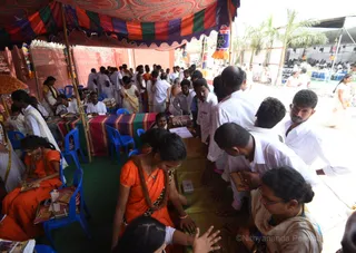 Manifesting Shaktis Demo Tent - Gurukul Balasants are demonstrating the Shaktis/Powers of Third Eye Reading and powers of 11 Dimensions through the Krishta Shila.