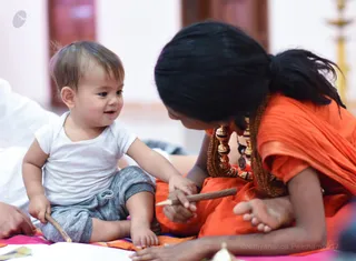 The youngest member of the program enjoys the Shaktis session!
