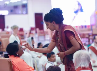 Delegates receive the Sacred Jnananjanam before the initiation.