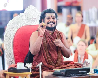 His Holiness holds a gold container of Sacred Jnananjanam