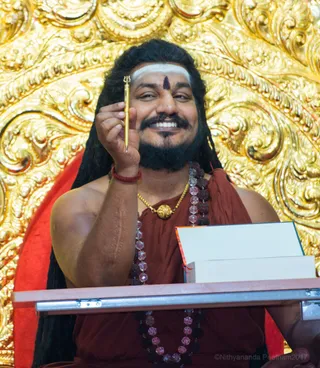 His Holiness autographs the Living Enlightenment books for each and every IA participant. What a rare blessing!!