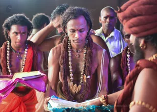 His Holiness blesses the Kalpataru Program certificates, showing the successful completion of the course.